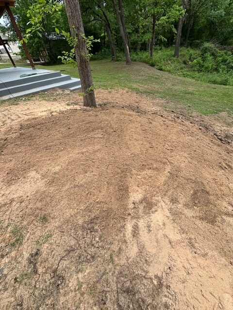 After: storm-damaged stump ground out and yard leveled by Two Stump Chumps
